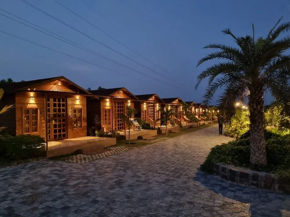 Poolside and lawn at Nirvana Resort, Kevadia