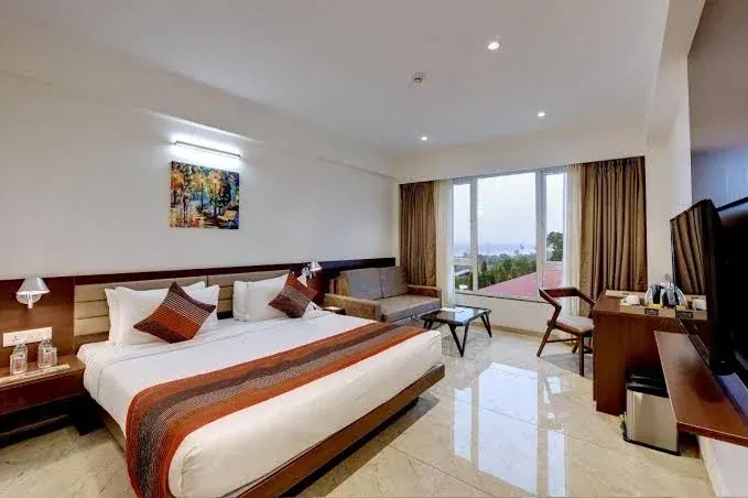 Room with Lounge Seating at The Fern Sardar Sarovar Resort